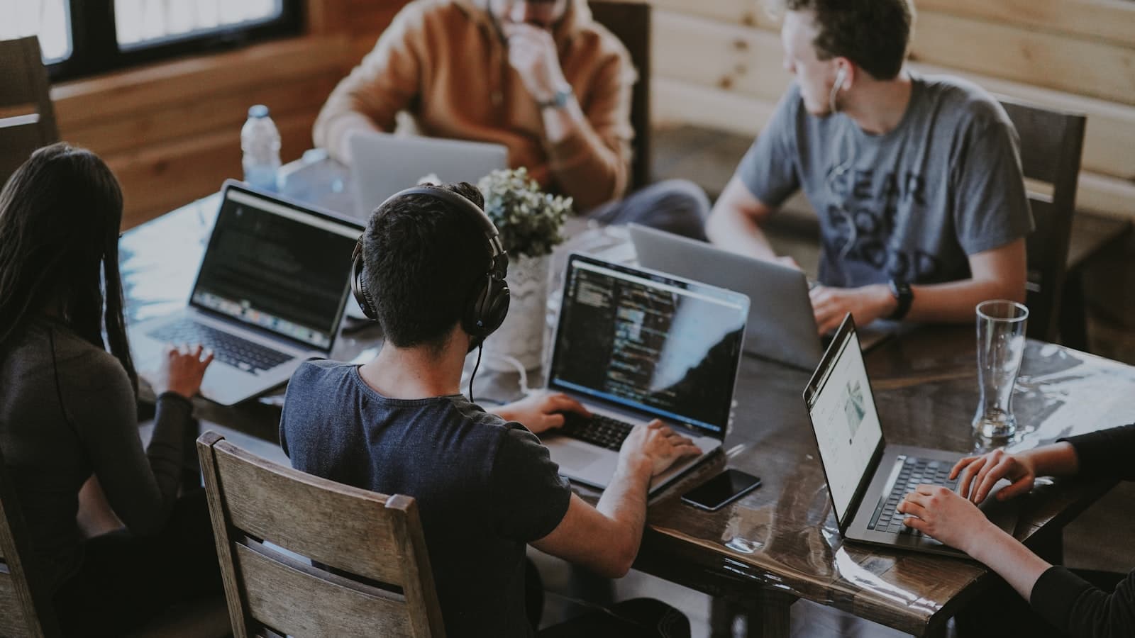 People sitting together working on laptops